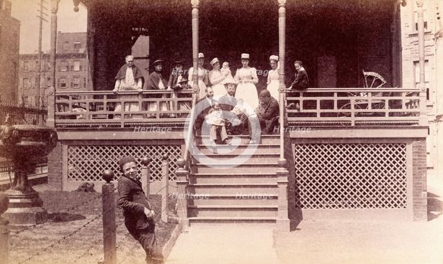 Bellevue Hospital, New York City: children patients, nurses and doctors sitting on a balcony in... Creator: Unknown.