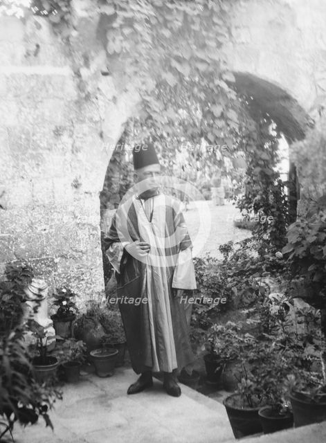 Benetti, Franco, Mr., standing outdoors, 1929 Creator: Arnold Genthe.