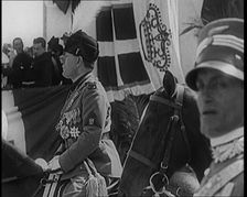 Benito Mussolini in Ceremonial Uniform on Horseback Reviewing Troops, 1926. Creator: British Pathe Ltd