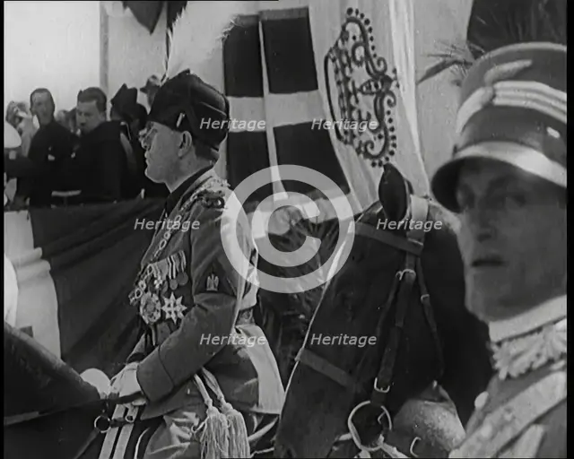 Benito Mussolini in Ceremonial Uniform on Horseback Reviewing Troops, 1926. Creator: British Pathe Ltd.
