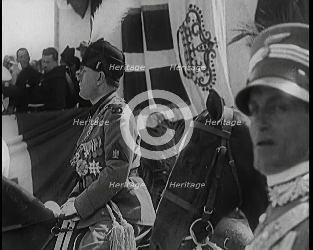 Benito Mussolini in Ceremonial Uniform on Horseback Reviewing Troops, 1926. Creator: British Pathe Ltd.