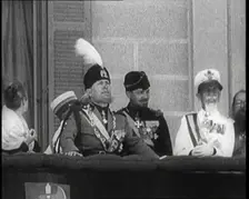 Benito Mussolini Reviewing Troops from a Balcony. Mussolini's Nose is Injured from an..., 1926. Creator: British Pathe Ltd