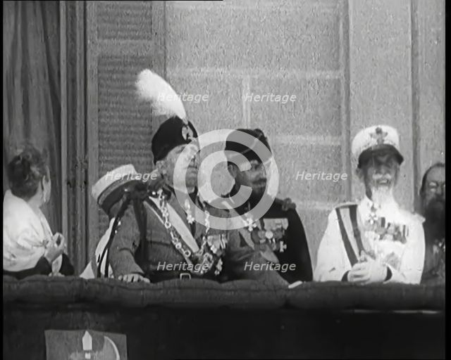 Benito Mussolini Reviewing Troops from a Balcony. Mussolini's Nose is Injured from an..., 1926. Creator: British Pathe Ltd.
