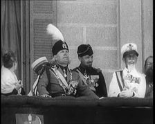 Benito Mussolini Reviewing Troops from a Balcony. Mussolini's Nose is Injured from an..., 1926. Creator: British Pathe Ltd