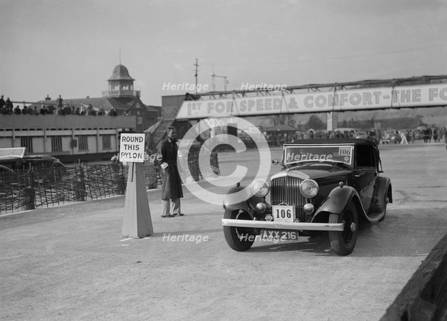 Bentley drophead coupe with Barker body competing in the JCC Rally, Brooklands, Surrey, 1939. Artist: Bill Brunell.