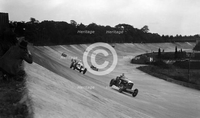 Bentley leading a Barnato-Hassan Special and a Jensen, October Long Handicap, Brooklands, 1938. Artist: Bill Brunell.