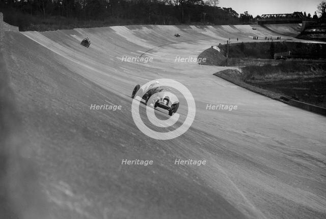 Bentley of Tim Birkin on the way to winning a race at a BARC meeting, Brooklands, 1930. Artist: Bill Brunell.