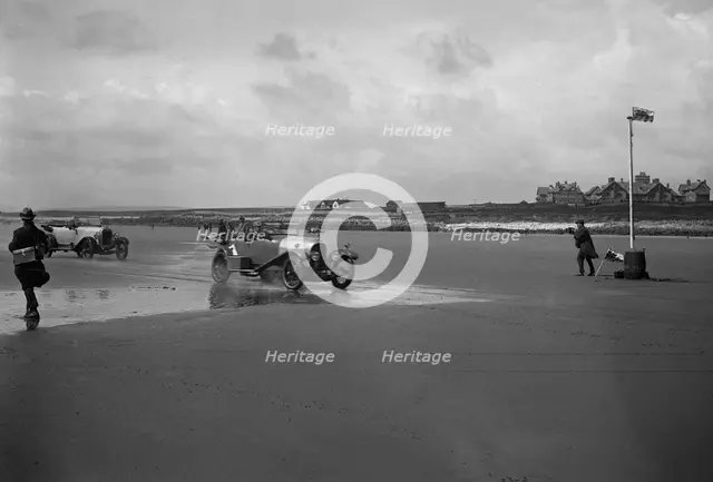 Bentley of ER Insole and Austin of RW Thomas competing in the Porthcawl Speed Trials, Wales, 1922. Artist: Bill Brunell.