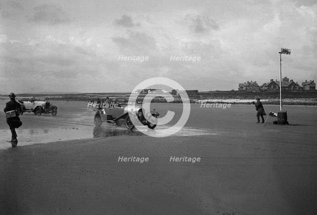 Bentley of ER Insole and Austin of RW Thomas competing in the Porthcawl Speed Trials, Wales, 1922. Artist: Bill Brunell.