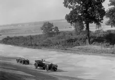 Bentley of FE Elgood and MG Magna of MB Watson racing at a MCC meeting, Brooklands, Surrey, 1933. Artist: Bill Brunell