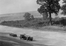 Bentley of FE Elgood and MG Magna of MB Watson racing at a MCC meeting, Brooklands, Surrey, 1933. Artist: Bill Brunell