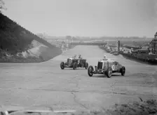 Bentley of Major H Butler and Lea-Francis Hyper racing at a BARC meeting, Brooklands, 1930. Artist: Bill Brunell