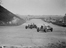 Bentley of Major H Butler and Lea-Francis Hyper racing at a BARC meeting, Brooklands, 1930. Artist: Bill Brunell