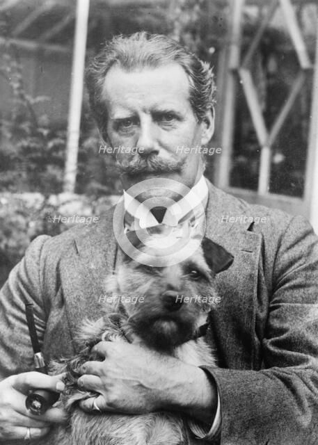 Bernard M. Partridge holding dog, 1910. Creator: Bain News Service.