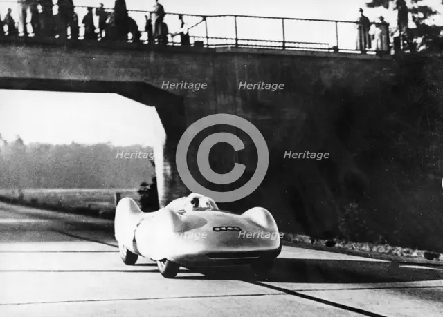 Bernd Rosemeyer driving an Auto Union, c1937-c1938. Artist: Unknown