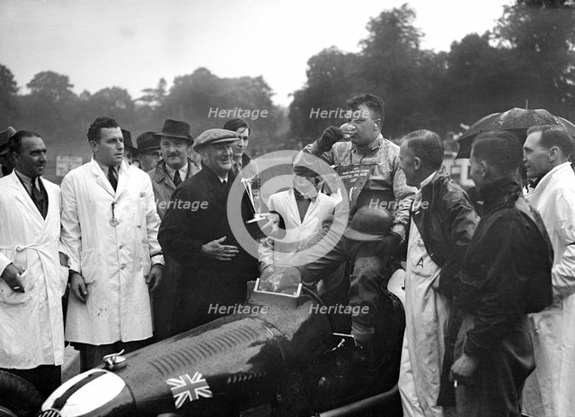 Bert Hadley and his winning Austin car, Imperial Trophy, Crystal Palace, 1939. Artist: Bill Brunell.