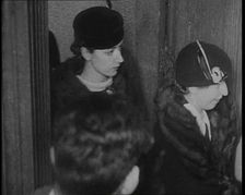 Bessie Mowat Goway AKA Betty Gow, Nurse of the Lindbergh Family Entering a Courtroom, 1930s. Creator: British Pathe Ltd