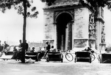 Bicycle taxis in the Place d'Etoile by the Arc de Triomphe, German-occupied Paris, August 1943
