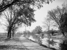 Bicycle path and canal, Indianapolis, Ind., between 1900 and 1910. Creator: Unknown
