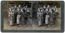 Big sisters and little brothers in the Land of the Rising Sun Yokohama, Japan, 1904. Artist: Underwood & Underwood