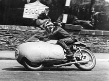 Bill Lomas at Governor's Bridge, Isle of Man Junior TT, 1955