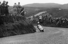 Bill Lomas riding an MV bike, 1955