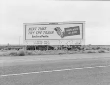 Billboard along U.S. 99...three destitute families...Kern County, CA, 1938. Creator: Dorothea Lange