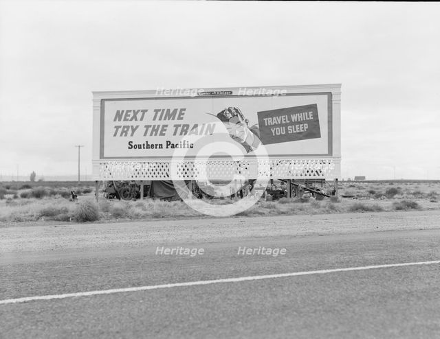 Billboard along U.S. 99...three destitute families...Kern County, CA, 1938. Creator: Dorothea Lange.
