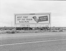 Billboard along U.S. 99...three destitute families...Kern County, CA, 1938. Creator: Dorothea Lange