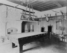 Billiard room, with a deer head and an elk head, in home of Edmund..., Greenwich, Connecticut, 1908. Creator: Frances Benjamin Johnston