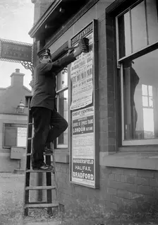 Billposting at Charwelton Station, Northamptonshire, 1904. Artist: A Newton