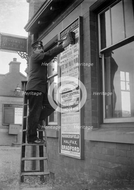 Billposting at Charwelton Station, Northamptonshire, 1904. Artist: A Newton