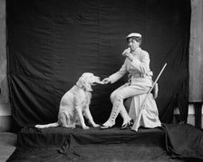 Billy and his mistress in hunting poses, between 1895 and 1910. Creator: Unknown