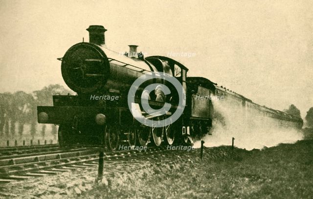 'Birmingham Express Picking Up Water at Ruislip, Great Western Railway', 1930. Creator: F. E Mackay.