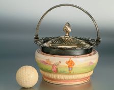 Biscuit barrel with golfing theme, Wood and Wood, c1893. Creator: Unknown