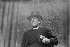 Bishop of Salisbury holding glasses and train schedule, 1910. Creator: Bain News Service