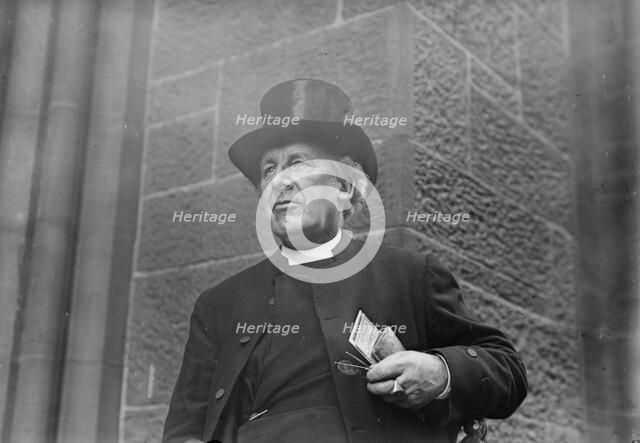 Bishop of Salisbury holding glasses and train schedule, 1910. Creator: Bain News Service.