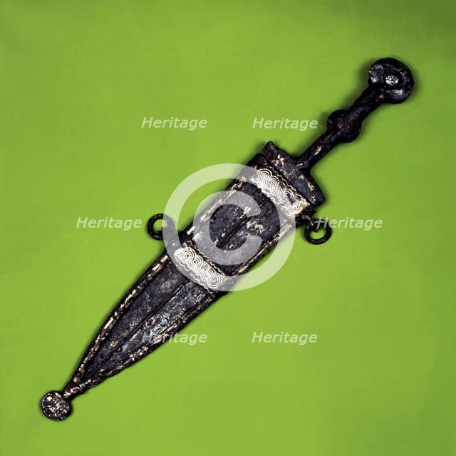 Bispherical dagger with cold meat decoration in silver on the scabbard. It comes from the Necropo…