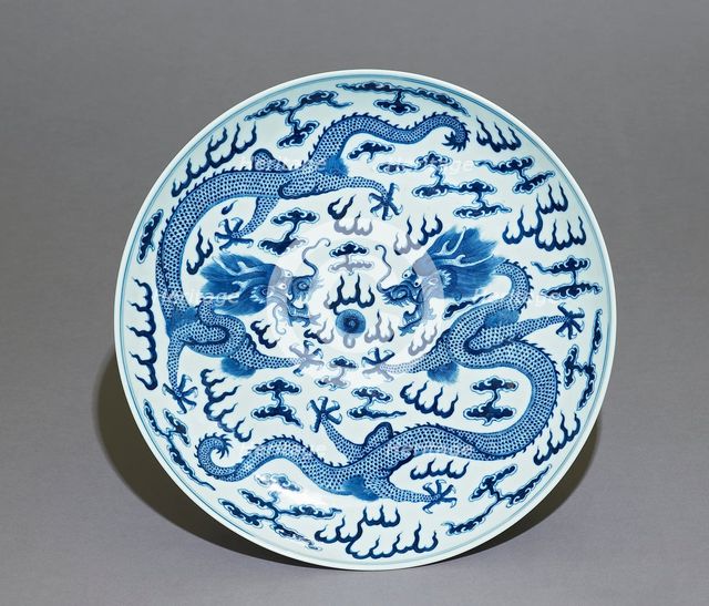 Blue-and-white dish, dragons chasing a flaming pearl, Qing Dynasty, Guangxu Period (1875 - 1908)) Artist: Unknown.