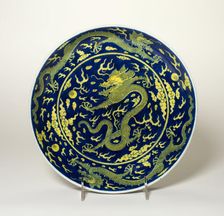 Blue-Ground Yellow-Enameled Dragon Dish, Qing dynasty, Qianlong reign (1736-1795). Creator: Unknown