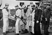 Blue jackets at work splicing a rope on board the battleship HMS Majestic 1896.Artist: Gregory & Co