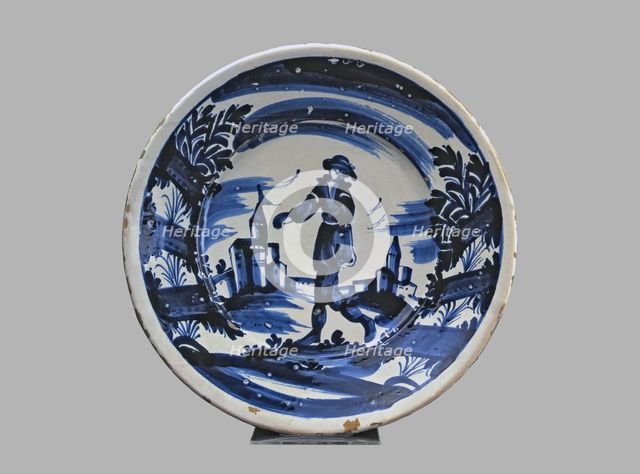 Blue plate with man and buildings, typical Catalan ceramics.