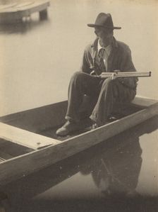 Black Man in Flat Boat, Holding Shotgun, 1929-1930. Creator: Doris Ulmann