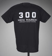 Black t-shirt for 300 Men March worn at a rally after the death of Freddie Gray, 2015. Creator: Gildan Activewear Inc.