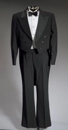 Black tail coat with white pocket handkerchief worn by Cab Calloway, 1976-1995. Creator: After Six