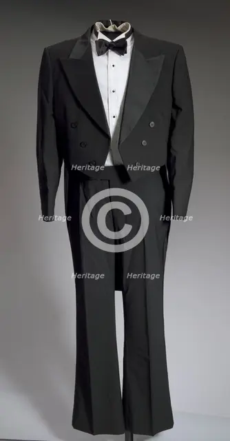 Black tail coat with white pocket handkerchief worn by Cab Calloway, 1976-1995. Creator: After Six.