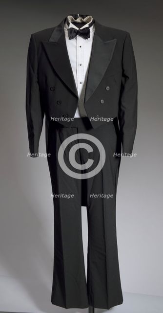 Black tail coat with white pocket handkerchief worn by Cab Calloway, 1976-1995. Creator: After Six.