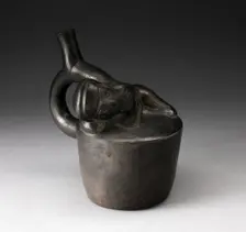 Blackware Handle Spout Vessel with Relief of a Reclining Musician with Pipes, 100 B.C./A.D. 500. Creator: Unknown