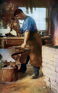 Blacksmith at work, England, c1922. Artist: Sidney H Nicholls