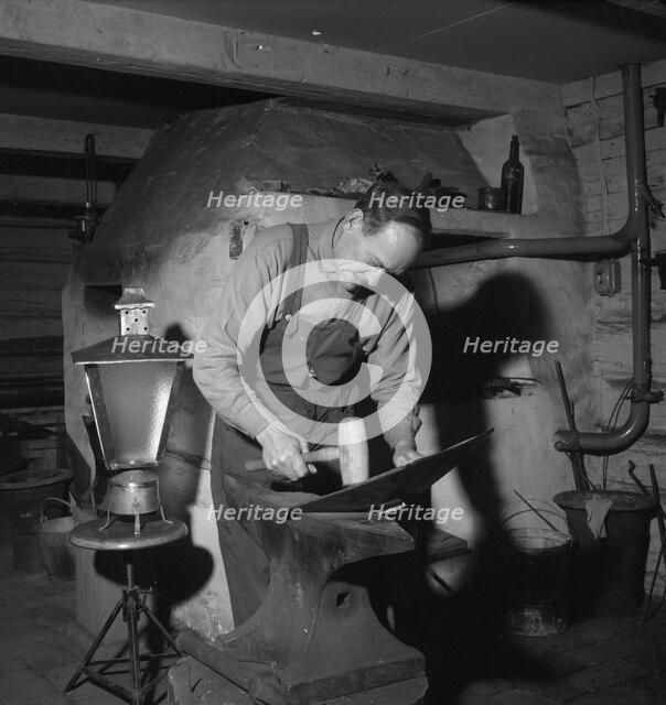 Blacksmith at work, Esklistuna, Södermanland, Sweden, 1960. Artist: Torkel Lindeberg